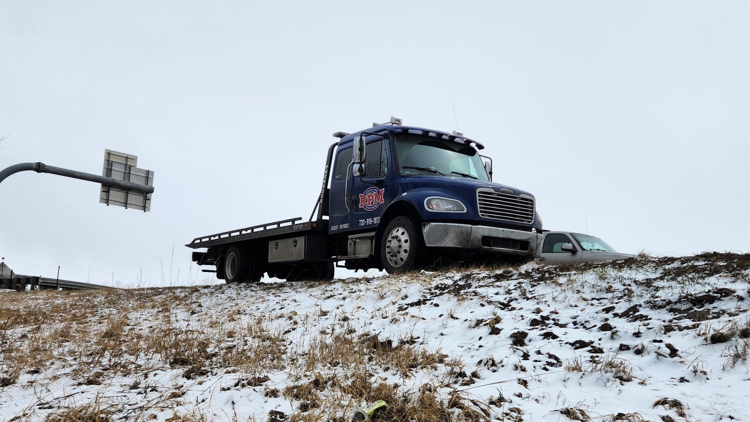 this image shows tow truck in Aurora, CO